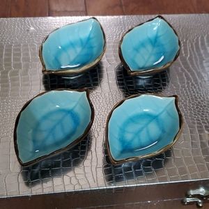 Set of four sauce dipping dishes